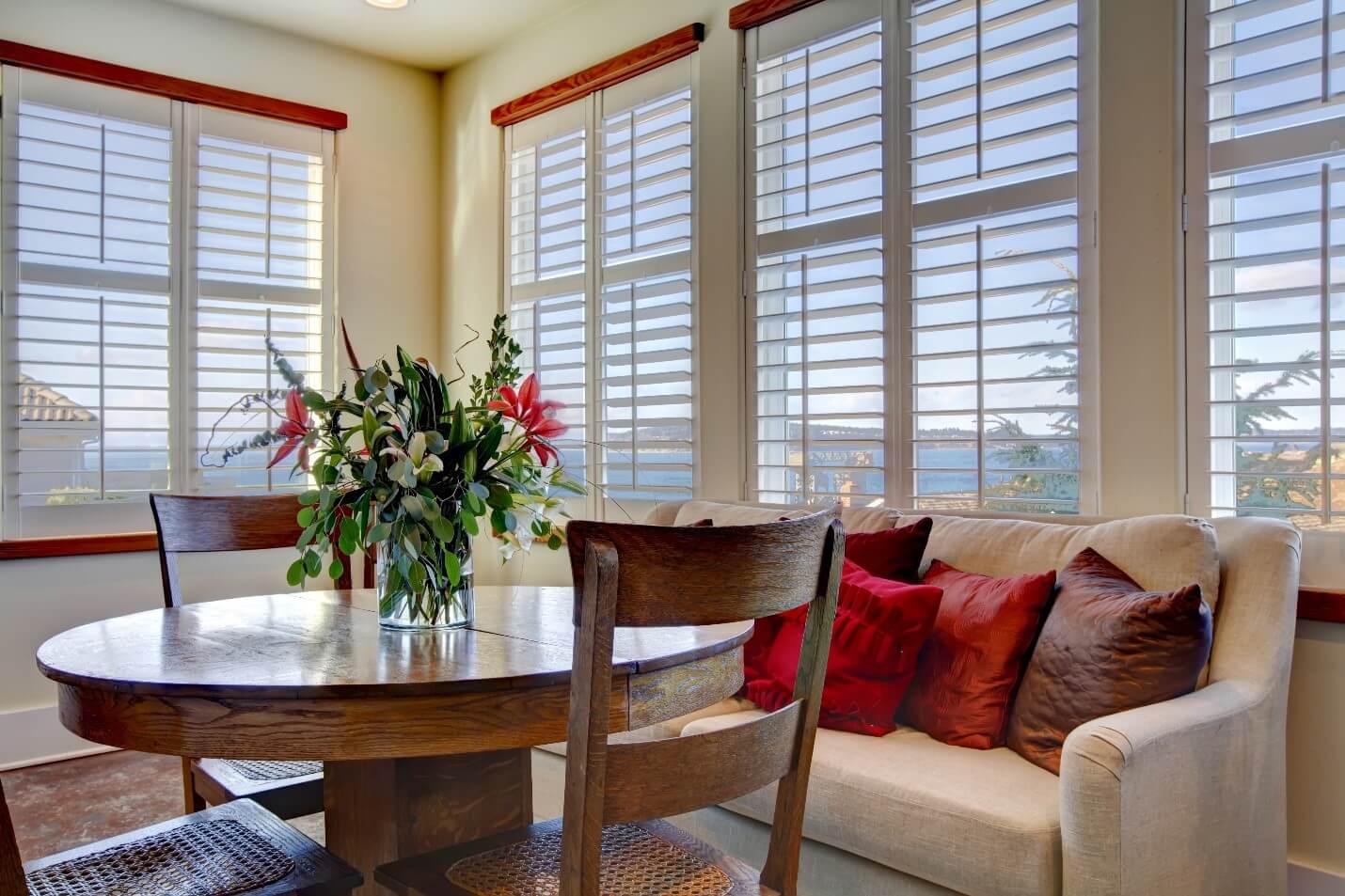 white plantation shutters in a coastal living room